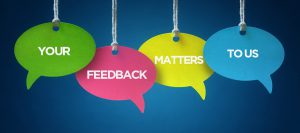 Image with hanging dialogue bubbles saying "your feedback matters to us"
