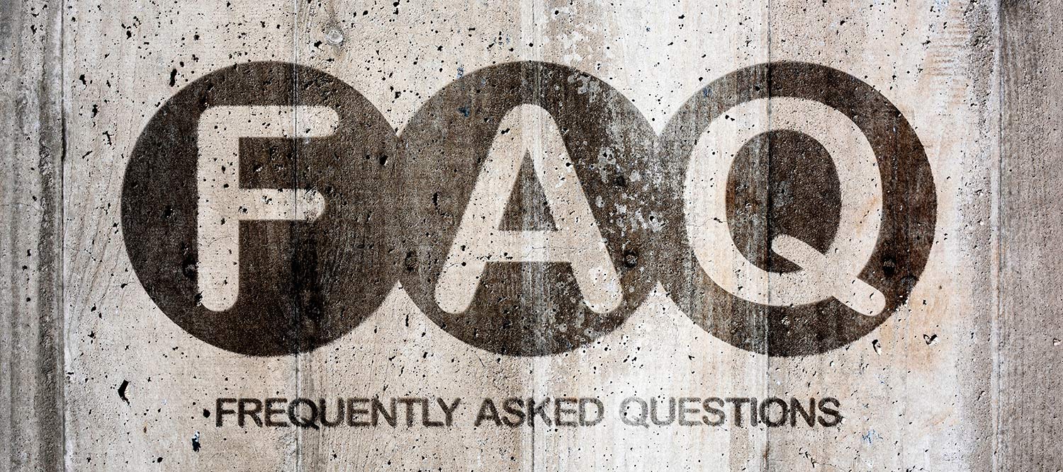 Concrete wall with letters FAQ and then words 'frequently asked questions' below